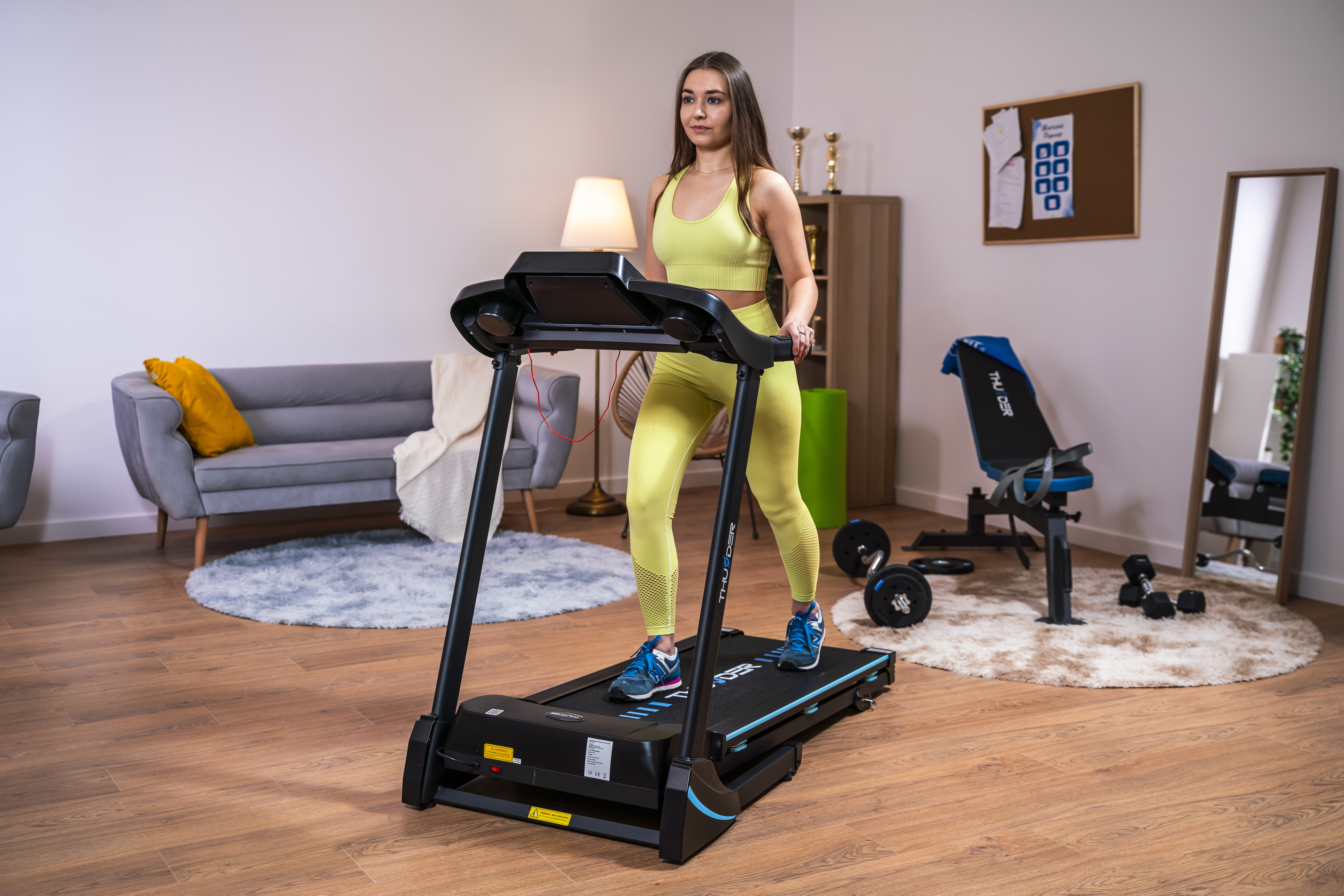 Modern electric treadmill in a home setting
